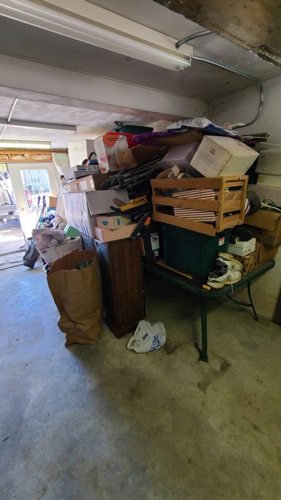 A large pile of boxes and miscellaneous items in a storage area for Junk Dunkers in Wrentham, MA