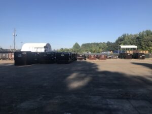 A large storage yard filled with numerous LDI dumpsters and containers for Liberty Disposal, Inc. in Tucson, AZ.