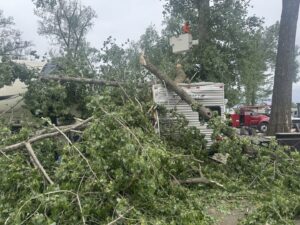 Emergency tree removal after storm damage, with a fallen tree on a camper, by JOCO Services LLC in Council Bluffs, IA.