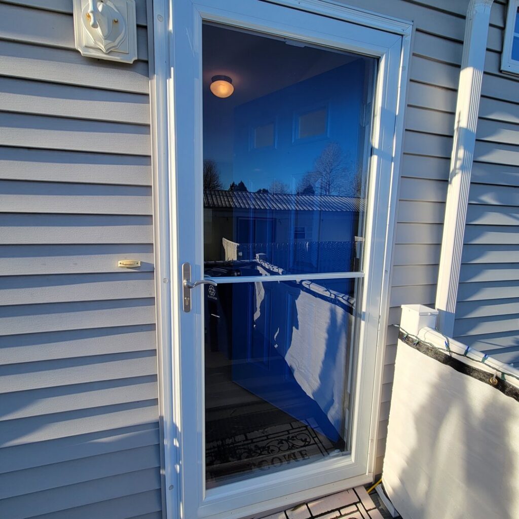 A newly installed storm or screen door on a house by Triple M Handyman in Portsmouth, NH.