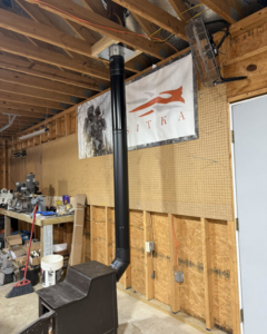 A new stove pipe installation in a workshop by Profix Home Repair in Jonesboro, AR.