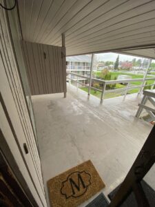 A street-side pile of cardboard boxes, plastic, and other debris awaiting pickup by JUNK IN THEE TRUNK in Kent, WA.