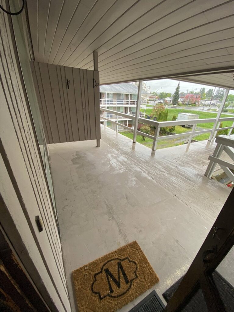 A street-side pile of cardboard boxes, plastic, and other debris awaiting pickup by JUNK IN THEE TRUNK in Kent, WA.