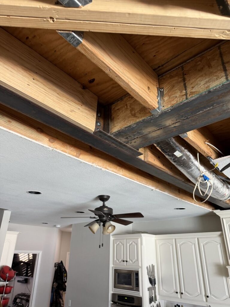 Structural beam installation during a kitchen renovation by Load Bearing Wall Pros in Plano, TX, opening up the space.