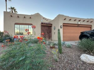 A beautiful stucco house with desert landscaping, completed by Old Pueblo Stucco, Inc. in Tucson, AZ