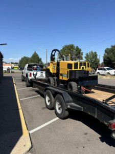 A Vermeer stump grinder on a trailer, ready for a job by Ace Tree Service in Denver, CO.