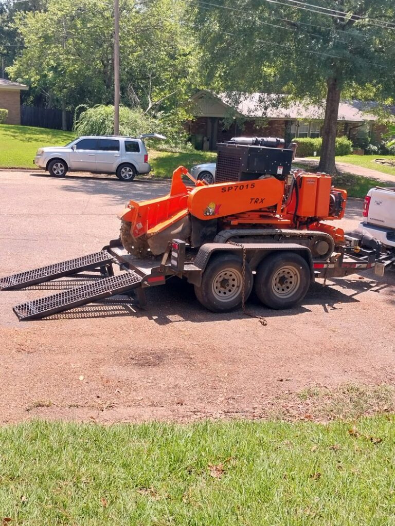 A stump grinder machine on a trailer, ready for tree service work by Jacinto's Tree Services in Montgomery, AL.