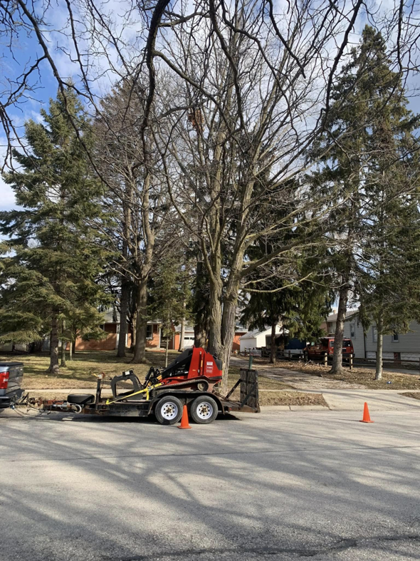 Tree service equipment, including a stump grinder on a trailer, ready for work by Palasz Tree Service in Milwaukee, WI.