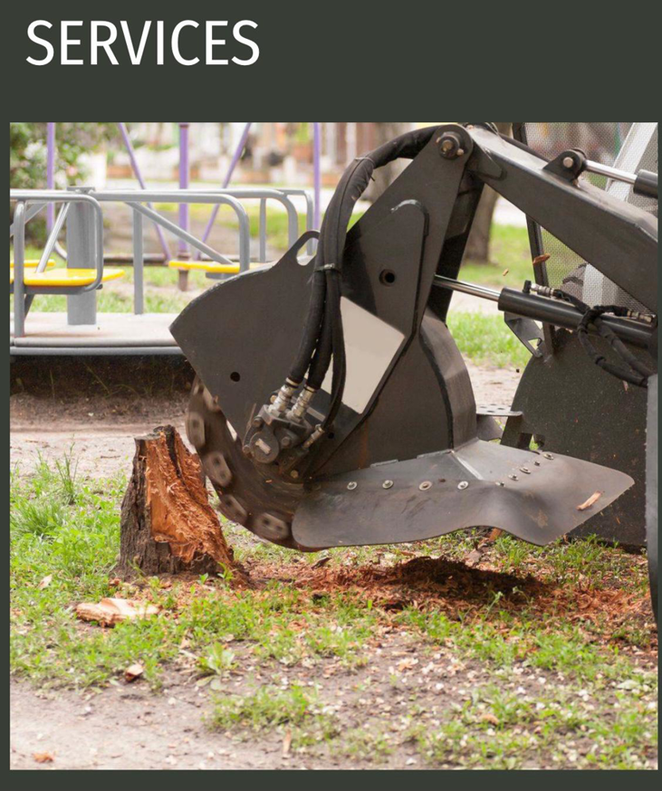 A stump grinding machine actively removing a tree stump as part of services by Green Land Tree services in Knoxville, TN