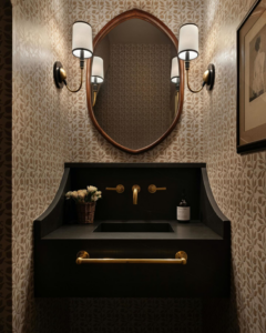 A stylish powder room featuring a unique vanity and mirror installed by ADAMS Pro Finish in Spring Hill, TN.