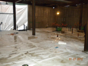 Interior construction site with sub-slab waterproofing membrane and structural beams by Crown Waterproofing Inc. Mount Vernon, NY.