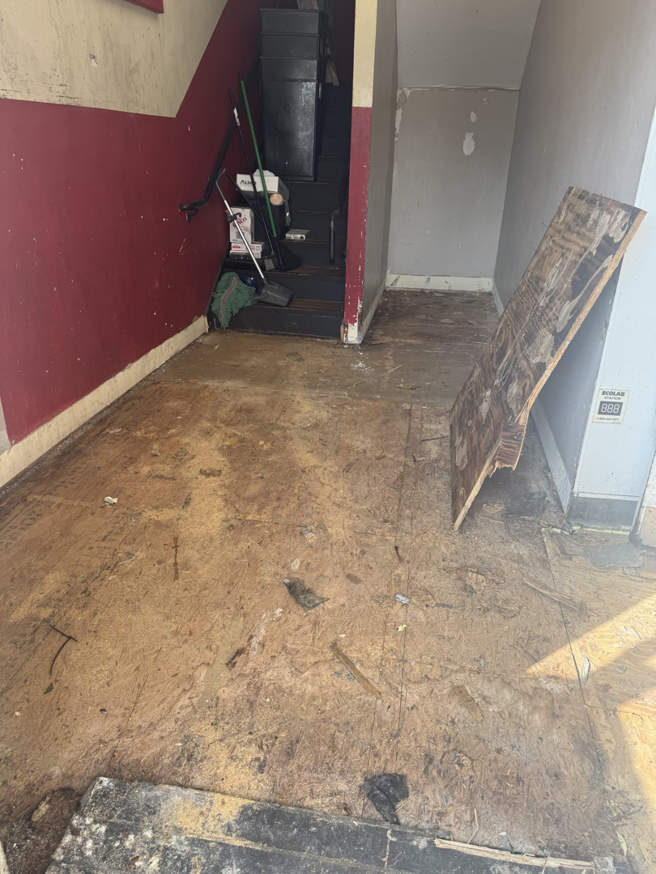 An exposed subfloor in a room after old flooring removal, part of a handyman service by Floorboys LLC in Lexington, SC.