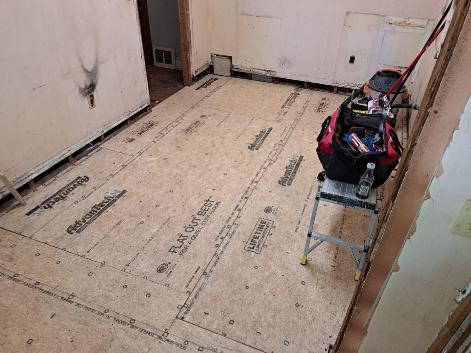Subfloor installation in progress with tools visible, completed by Vest Home Services LLC in Greenville, SC.