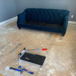 Subfloor preparation for new flooring with a tile cutter by Just Floor It Hardwood Floors LLC in Philadelphia, PA