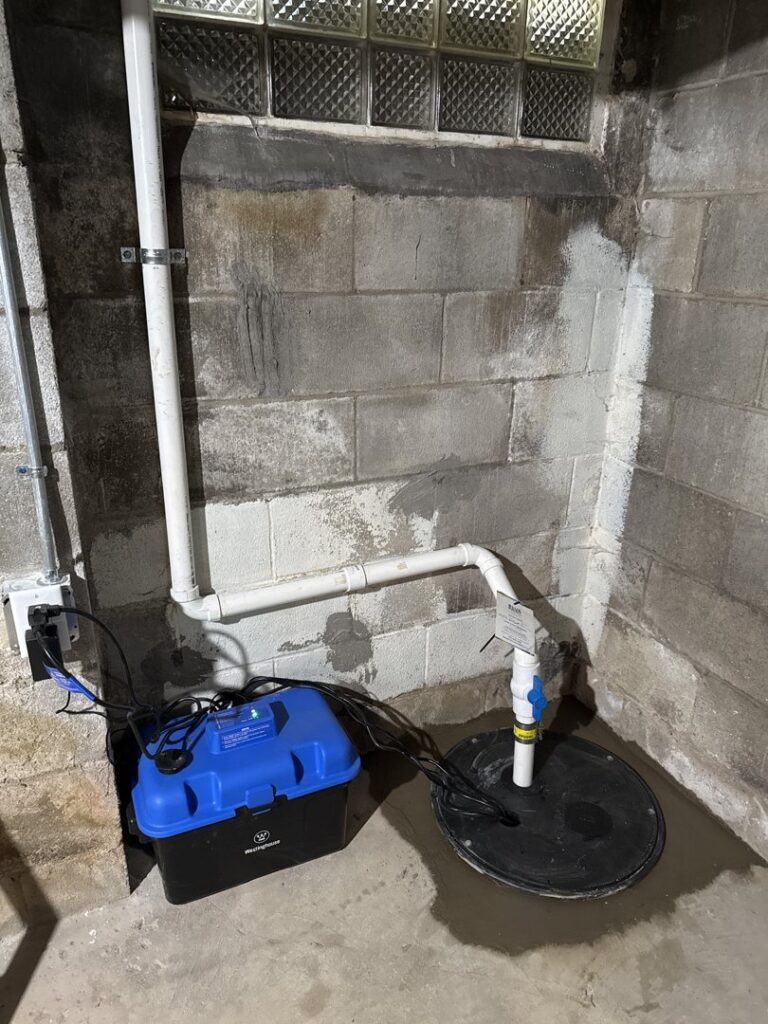 A newly installed sump pump system in a basement by The Basement Doctor in Reynoldsburg, OH.
