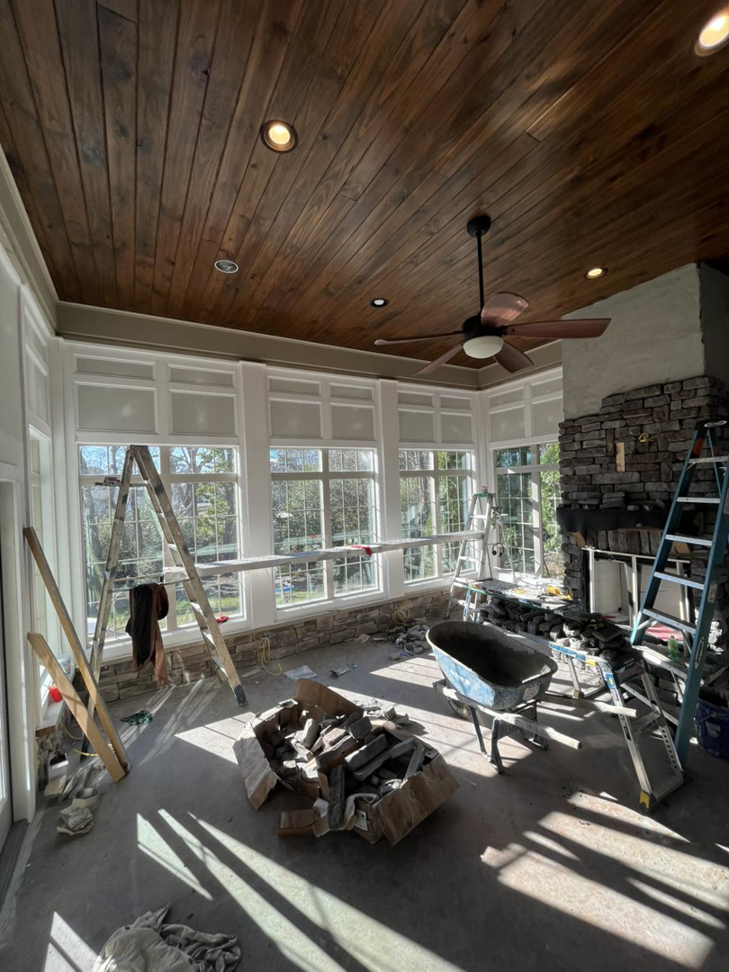 A sunroom interior renovation in progress, including fireplace work, by PrimeTime Painting in Bowling Green, KY.