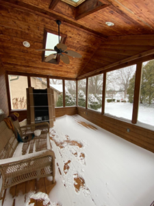 Snow covering the floor inside a sunroom, indicating a repair job needed by Sunspace of Central Ohio in Columbus, OH.