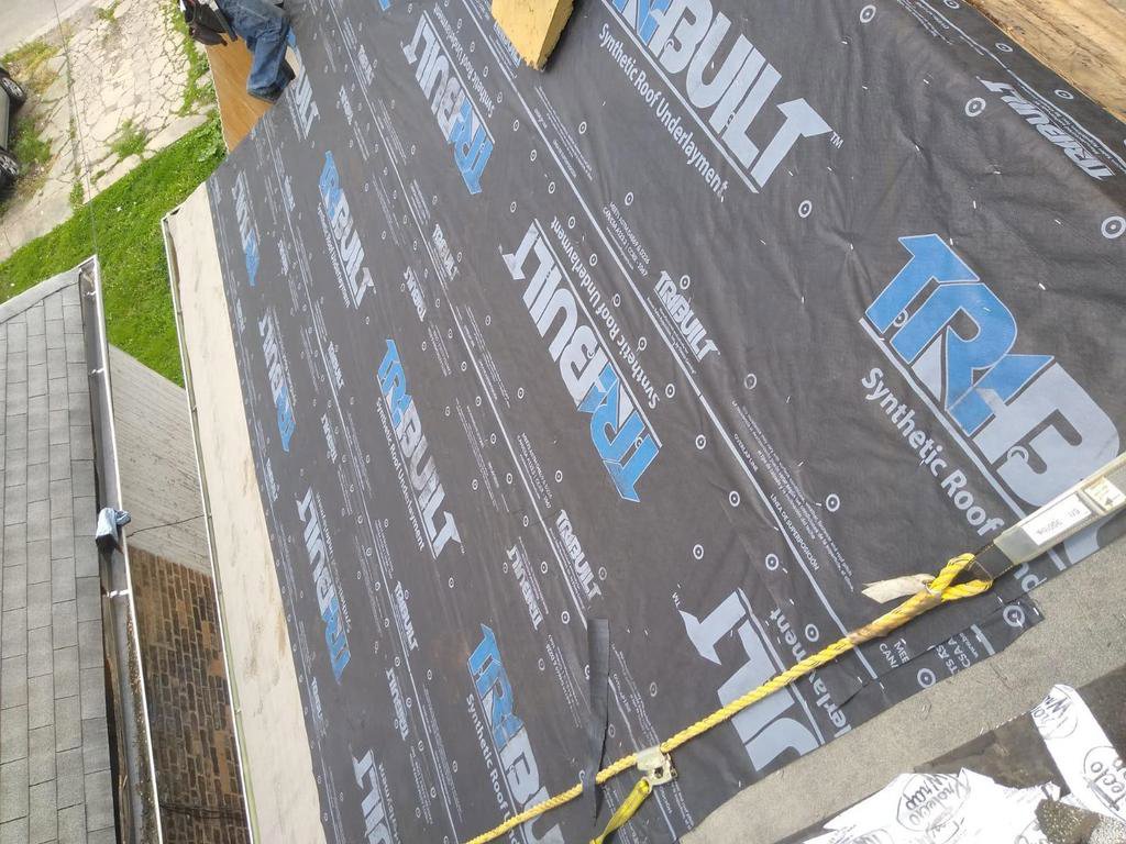 Synthetic roof underlayment being installed on a roof by Pro DK Contractor LLC in Chicago, IL.