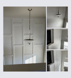 A tall accent wall with decorative paneling and a new light fixture installed by Shawn's Handyman Services in Fishers, IN.