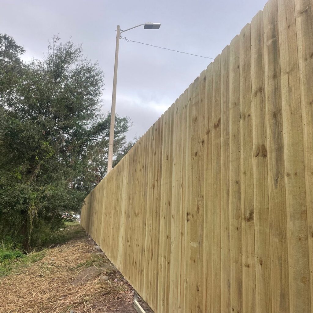 A tall, newly installed wooden privacy fence providing security by Keeler Fence in New Port Richey, FL.