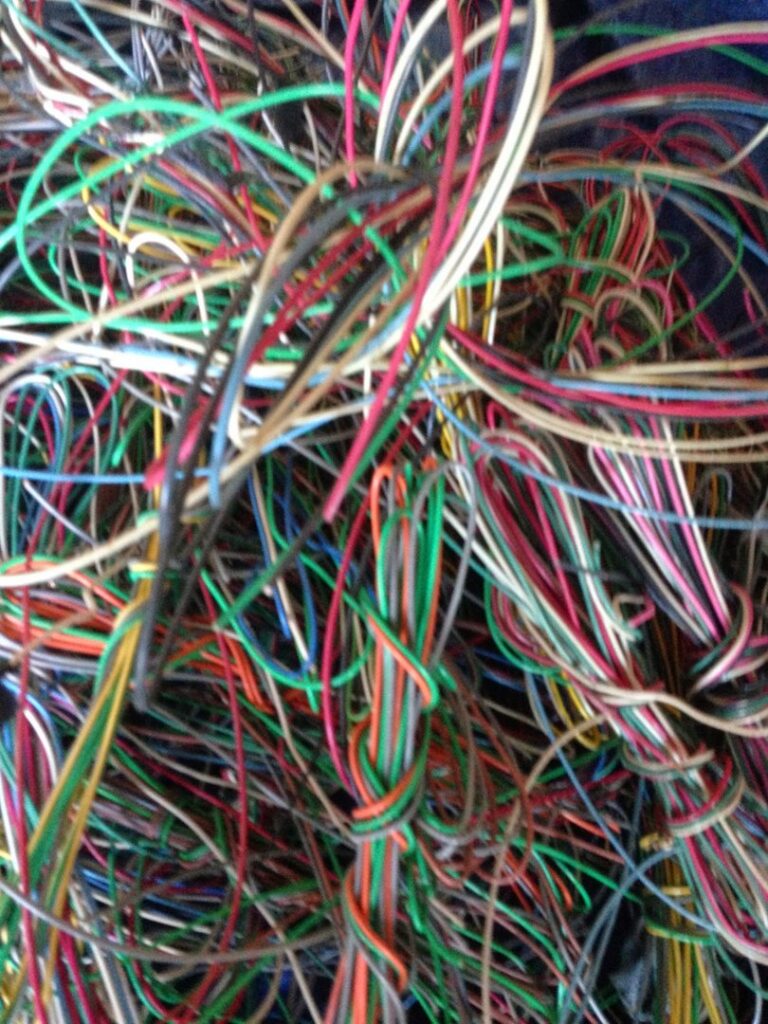 A close-up view of tangled colorful electrical wires, ready for recycling by RZR Recycling in Phoenix, AZ.