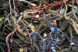 A large pile of tangled electrical wires collected for scrap recycling by Bee Green Recycling in Richmond, VA