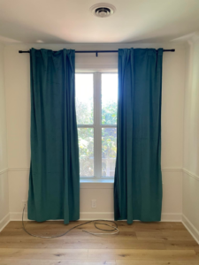 Expert installation of teal curtains and window treatments by Berryhill Handyman and Home Preservation in Jonesboro, AR.