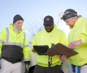 A team of Prairie Insulation LLC contractors discussing a project on site in Springfield, IL.