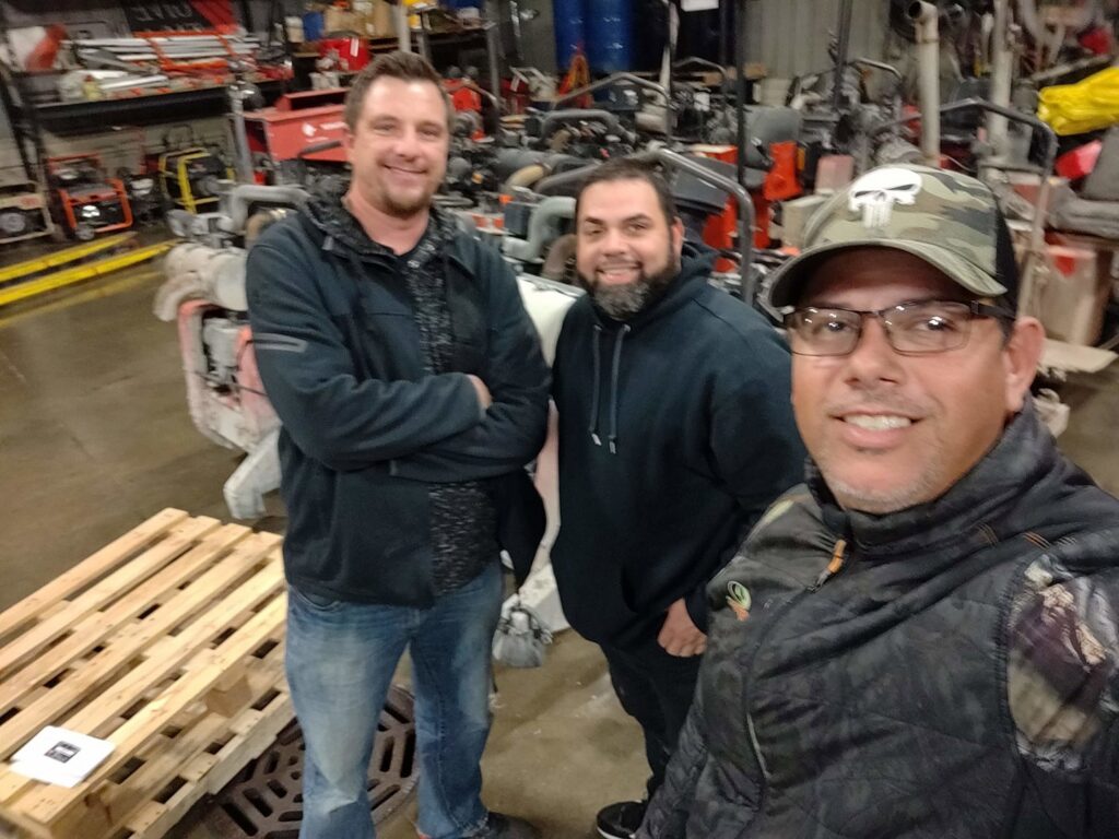 A team of professionals with heavy equipment in their workshop at Interstate Sealant & Concrete, Inc. in Waukesha, WI.