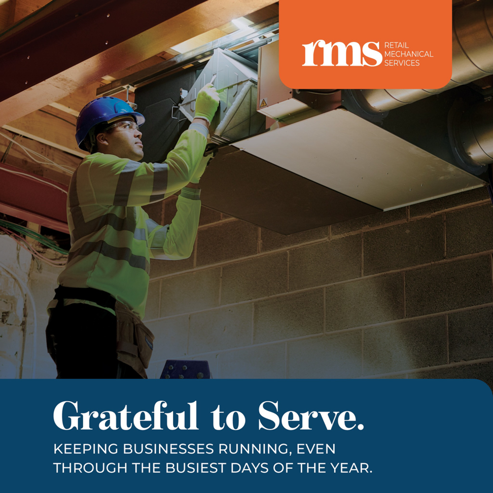 A technician in a hard hat working on an overhead duct system at Retail Mechanical Services in Bohemia, NY