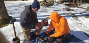 Technicians from Advanced Rooter Plumbing repairing a well pump outdoors in Norwalk, CT