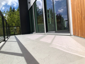 A beautifully finished textured balcony deck coating completed by Titan Exteriors in Hillsboro, OR.
