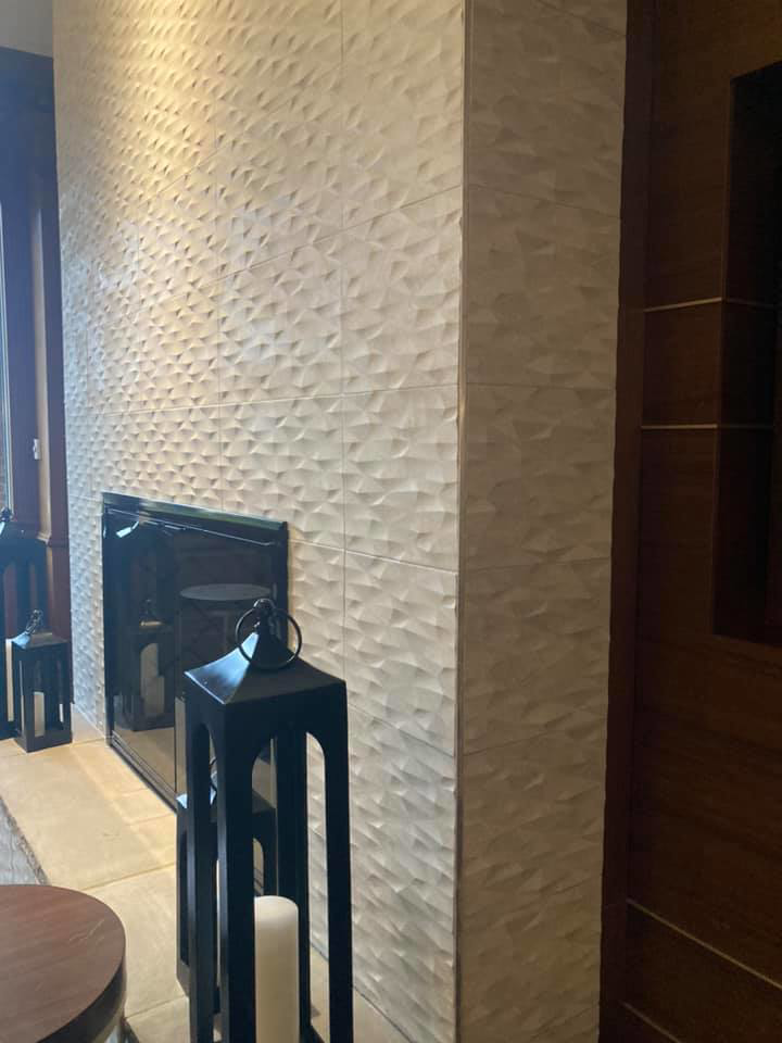 Interior fireplace wall featuring modern textured tile installation by Old Style European Stucco & Masonry in Brentwood, TN