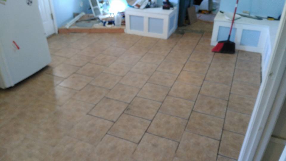 Tile floor installation in progress in a room, showcasing a handyman service by MG'S Services LLC in Albuquerque, NM.