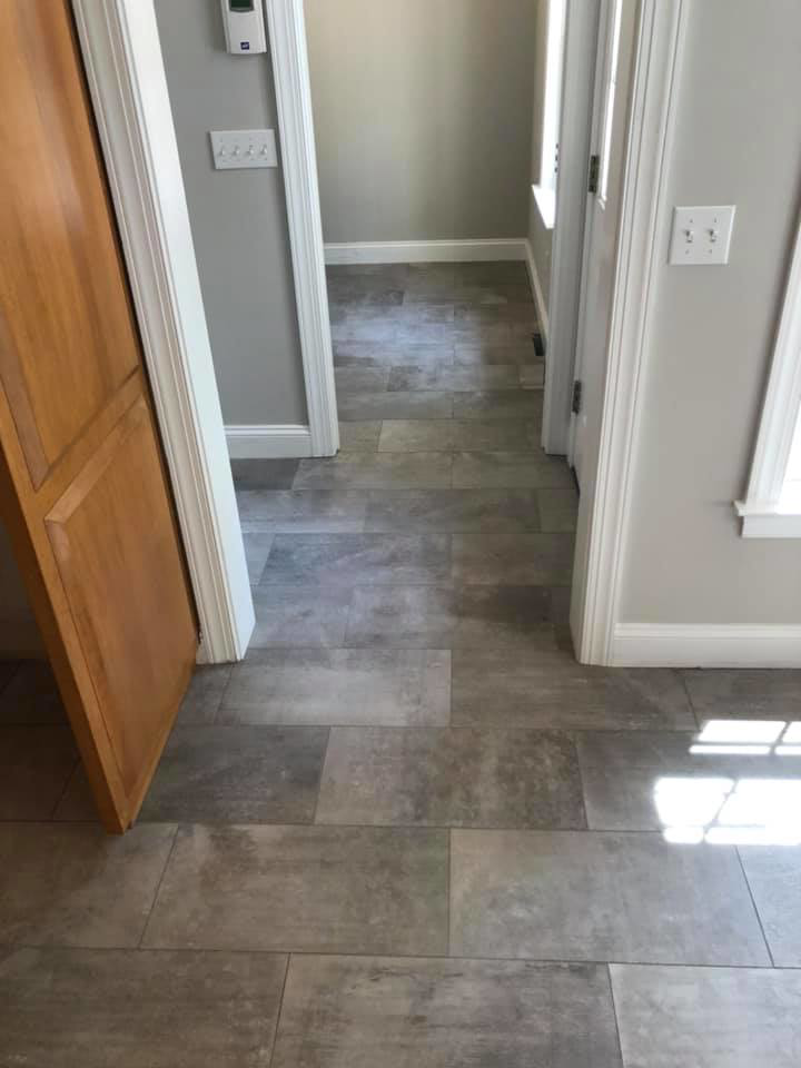 New tile flooring installed in a hallway by Stapleford Flooring LLC in Milford, DE.