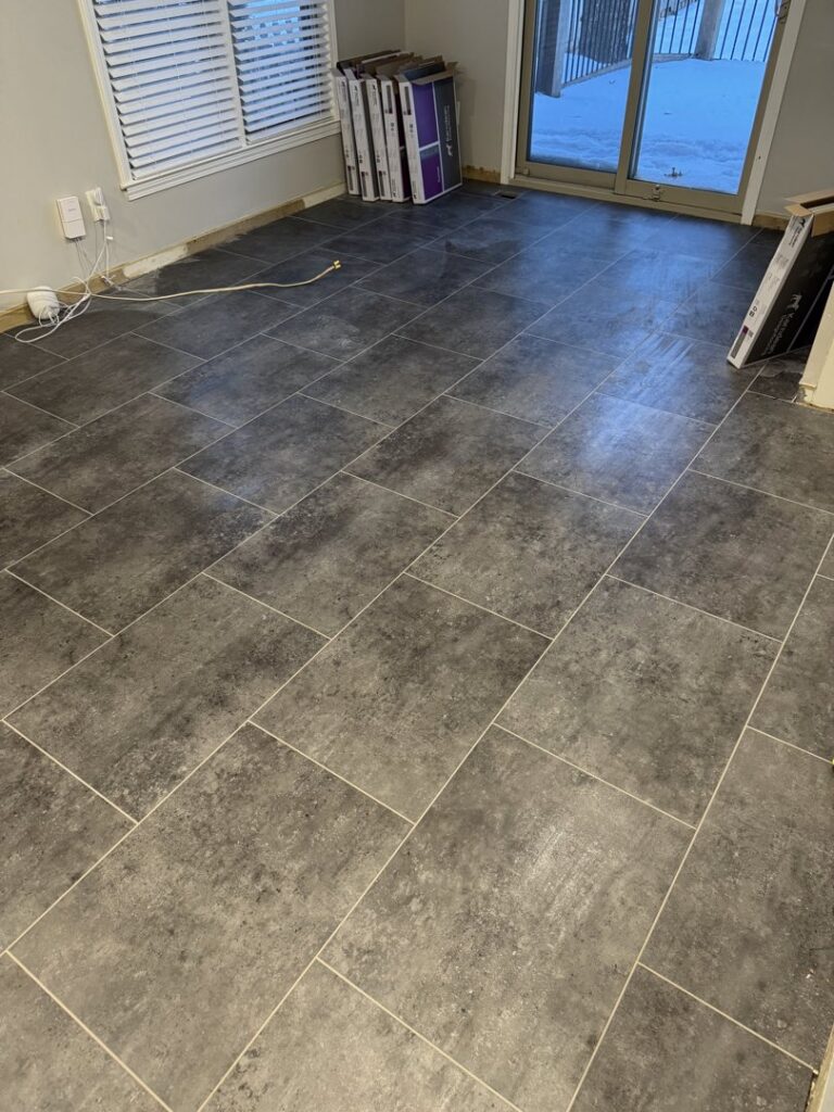 New tile flooring being installed in a room by Gateway Home Services KC LLC in Kansas City, MO.