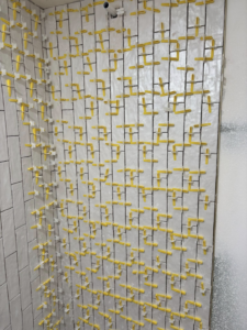 Tile installation in progress on a shower wall, a service provided by Considerate Repair in Walla Walla, WA.