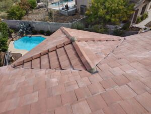 A beautiful tile roof overlooking a backyard pool, completed by Mayitos roofing LLC in Tucson, AZ.