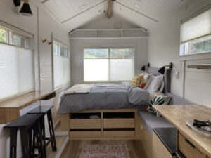 Custom carpentry and built-in storage in a tiny home bedroom by Top Shelf Handyman Pros in Post Falls, ID