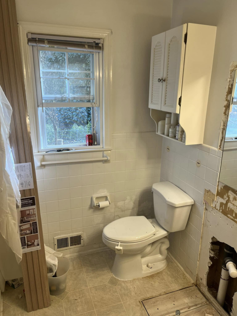 Toilet area in a bathroom during renovation, with exposed wall and materials by JTL Contracting Services LLC in Inver Grove Heights, MN