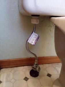 A new flexible water supply line and shut-off valve installed for a toilet by Boise Handyman & Remodel in Boise, ID.