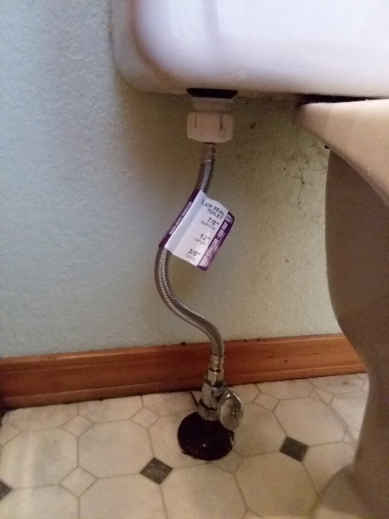 A new flexible water supply line and shut-off valve installed for a toilet by Boise Handyman & Remodel in Boise, ID.