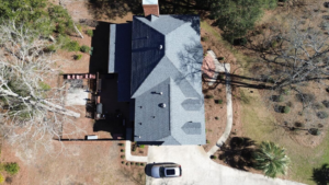 A top-down aerial view showcasing a complex gray shingle roof installed by Coastal Roofing Solutions LLC in Charleston, SC.