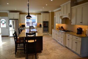 A spacious traditional kitchen with an island and granite countertops by Creasey Construction of Illinois, Inc. in Springfield, IL