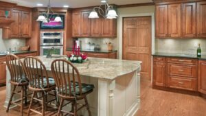 A traditional kitchen remodel featuring wooden cabinets and a granite island by Saunders Dynamic Remodeling in Columbus, OH
