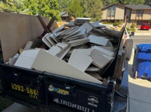 A Junk Solutions trailer filled with construction debris and old tiles, ready for removal in Ogden, UT.