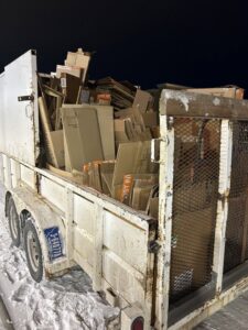 A trailer completely full of flattened cardboard boxes, showcasing a junk removal and recycling service by Empty It Out Junk Removal, LLC in Billings, MT.