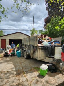 A large trailer filled with household junk and debris during a general junk removal job by CC JUNK Removal in Corpus Christi, TX.