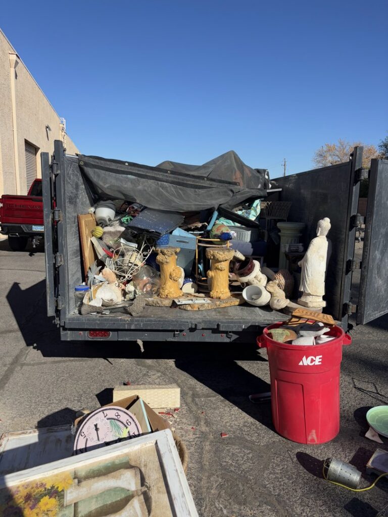A Gone Junkin' Vegas trailer filled with various household junk items and debris for removal in Henderson, NV.