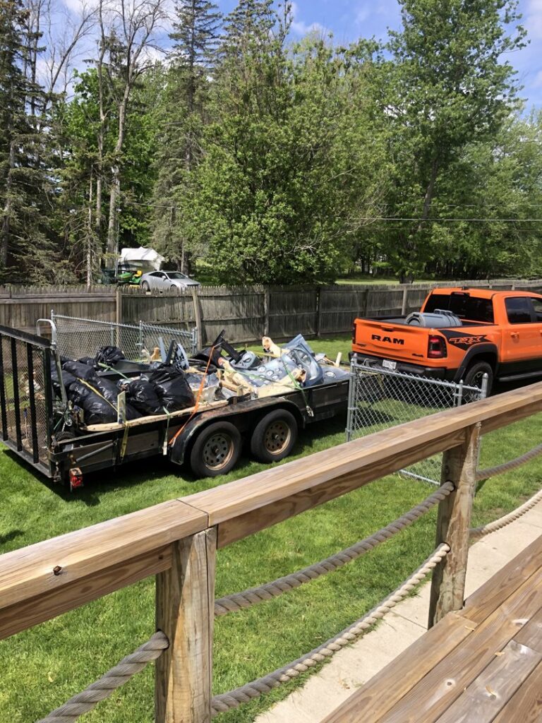 A trailer full of black trash bags and various debris, ready for junk removal by Frankie's Removal Services & Dumpster Rental in Buffalo, NY